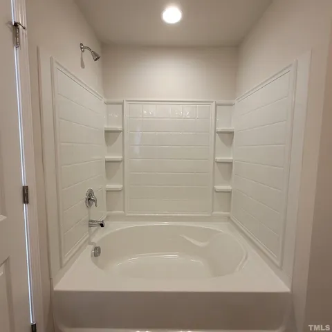a bathroom with a bathtub