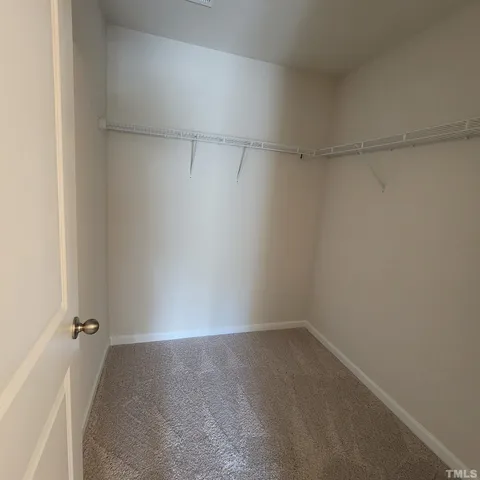 a view of a room with shelf on the wall