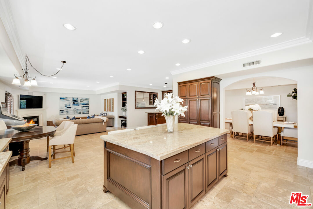 13834 Ordin Ranch Rd Valley Valley Glen, CA 91401 - Photo 11 of 35 a living room with stainless steel appliances kitchen island granite countertop furniture and a view of kitchen