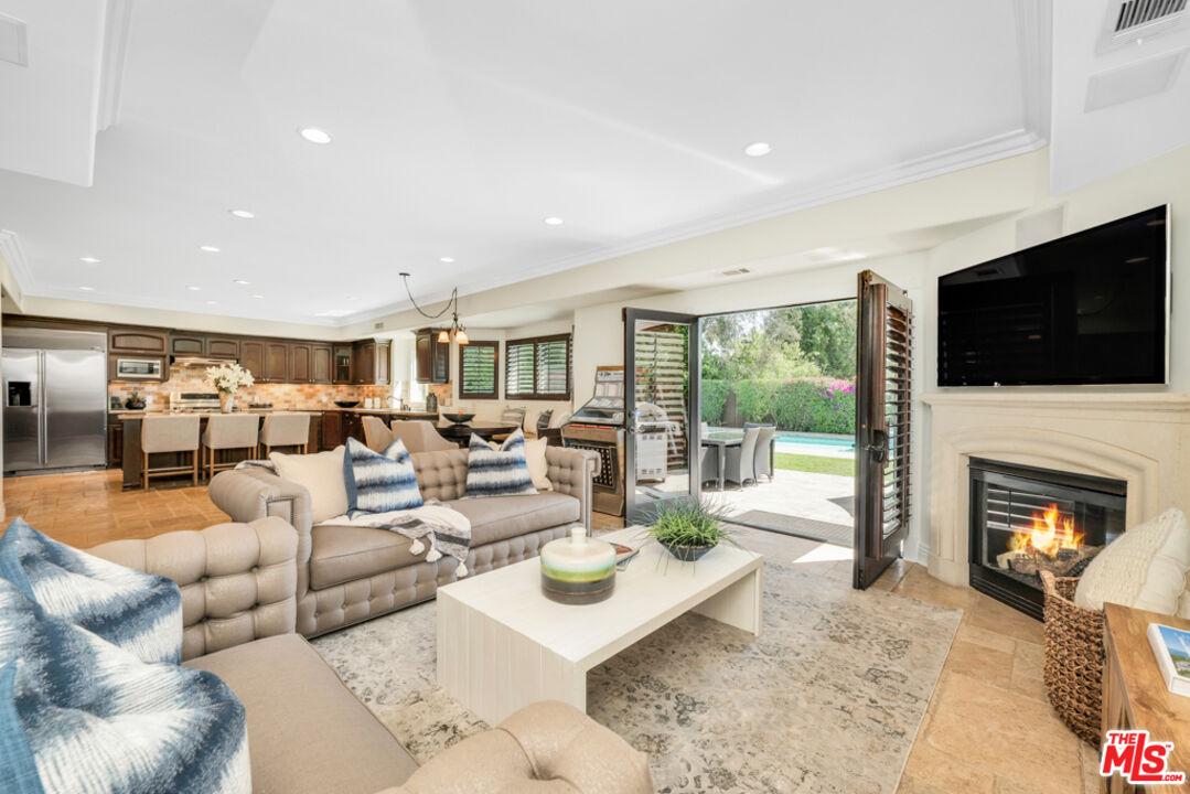 13834 Ordin Ranch Rd Valley Valley Glen, CA 91401 - Photo 14 of 35 a living room with furniture fireplace and flat screen tv