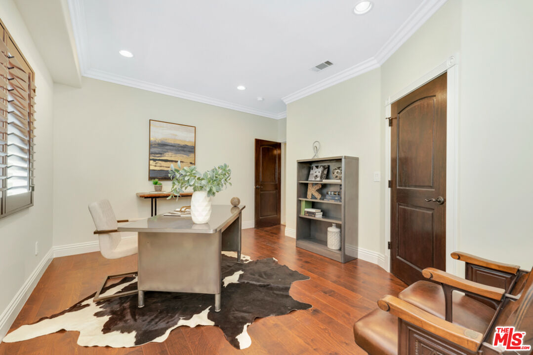 13834 Ordin Ranch Rd Valley Valley Glen, CA 91401 - Photo 16 of 35 a workspace with furniture and wooden floor
