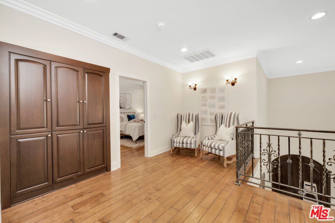 13834 Ordin Ranch Rd Valley Valley Glen, CA 91401 - Photo 21 of 35 a view of a livingroom with furniture and hardwood floor