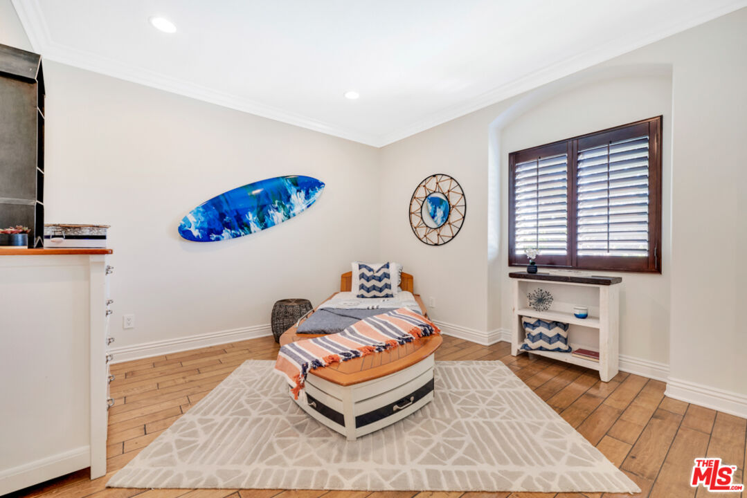 13834 Ordin Ranch Rd Valley Valley Glen, CA 91401 - Photo 25 of 35 a living room with furniture and a flat screen tv