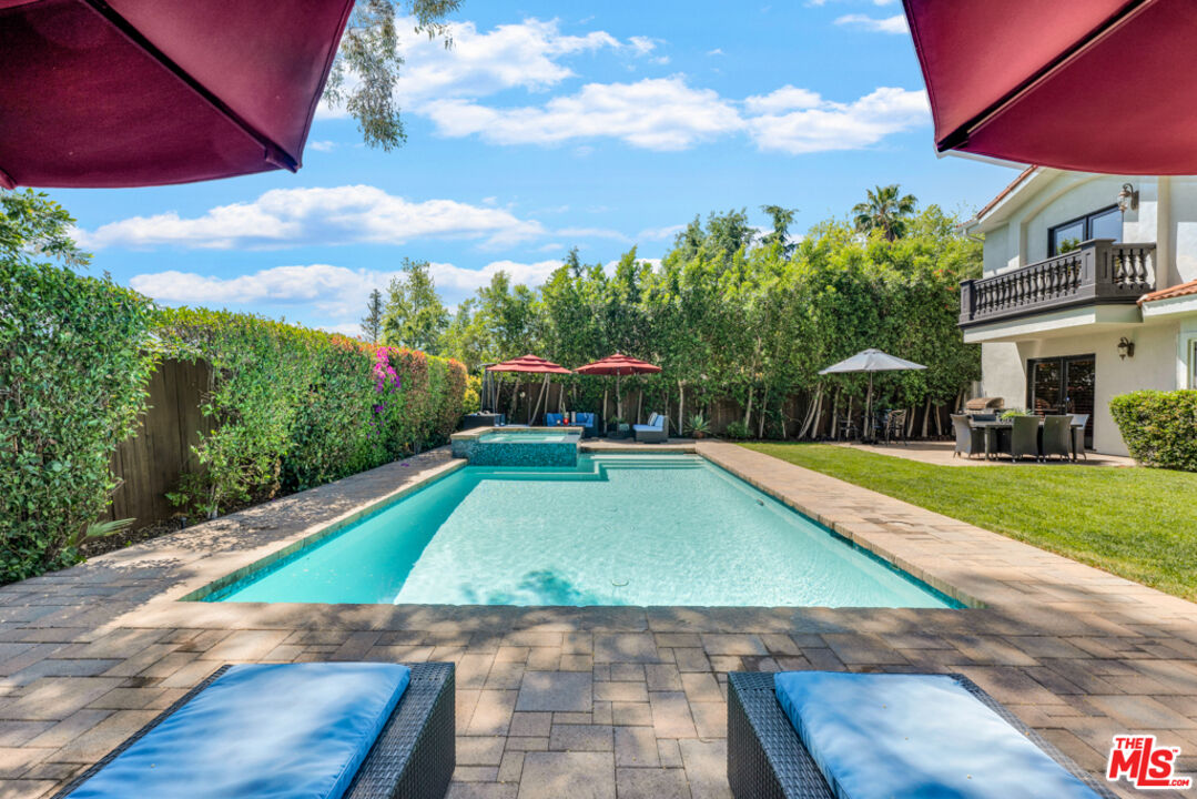 13834 Ordin Ranch Rd Valley Valley Glen, CA 91401 - Photo 26 of 35 a view of a swimming pool with lounge chair