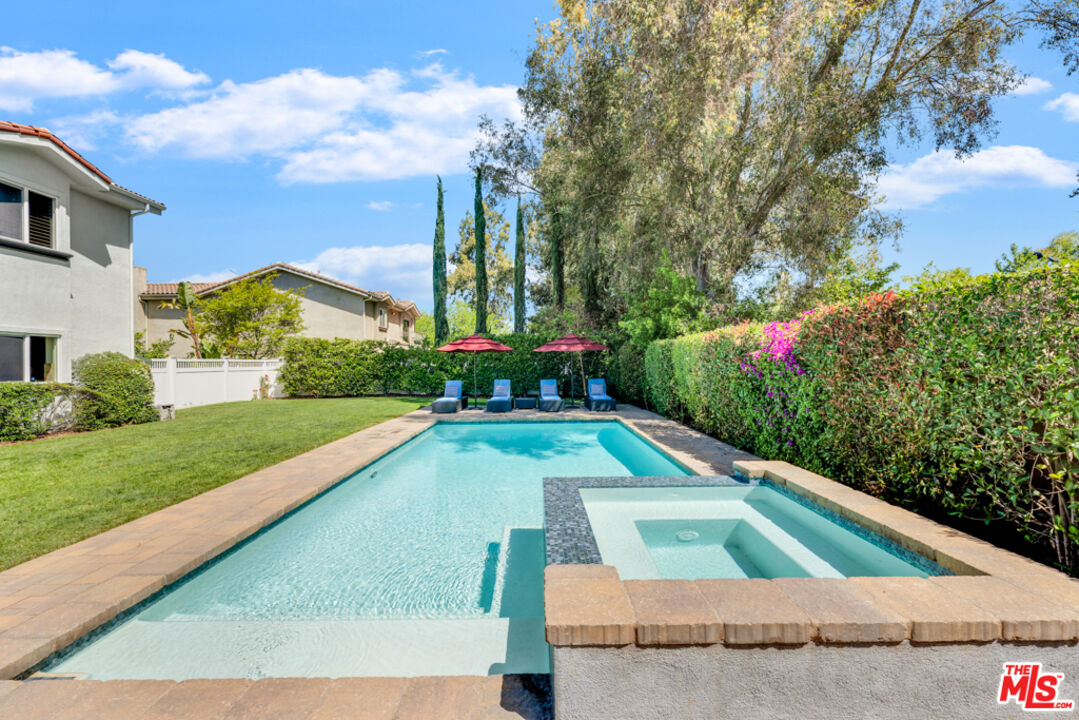 13834 Ordin Ranch Rd Valley Valley Glen, CA 91401 - Photo 27 of 35 a view of a swimming pool with a yard