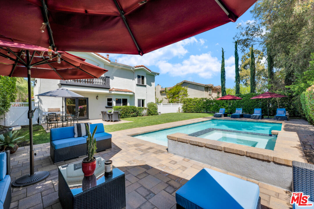 13834 Ordin Ranch Rd Valley Valley Glen, CA 91401 - Photo 28 of 35 a view of a house with backyard sitting area and garden