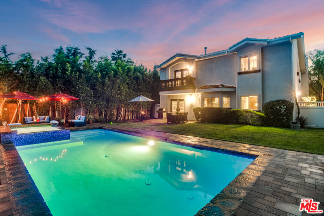 13834 Ordin Ranch Rd Valley Valley Glen, CA 91401 - Photo 3 of 35 a view of a house with a swimming pool and a yard