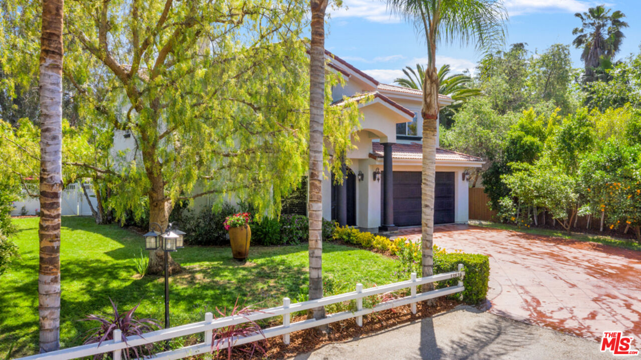 13834 Ordin Ranch Rd Valley Valley Glen, CA 91401 - Photo 33 of 35 a front view of a house with a yard table and chairs