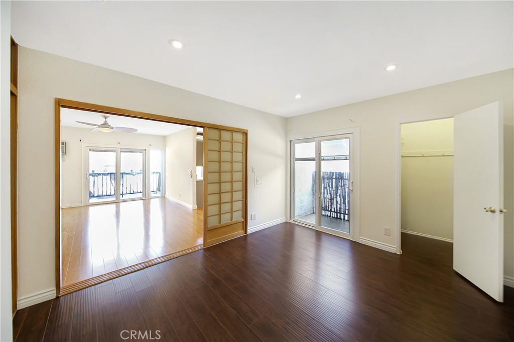 409 Burchett Street, Unit 315 Glendale, CA 91203 - Photo 3 of 34 a view of an empty room with wooden floor and a window