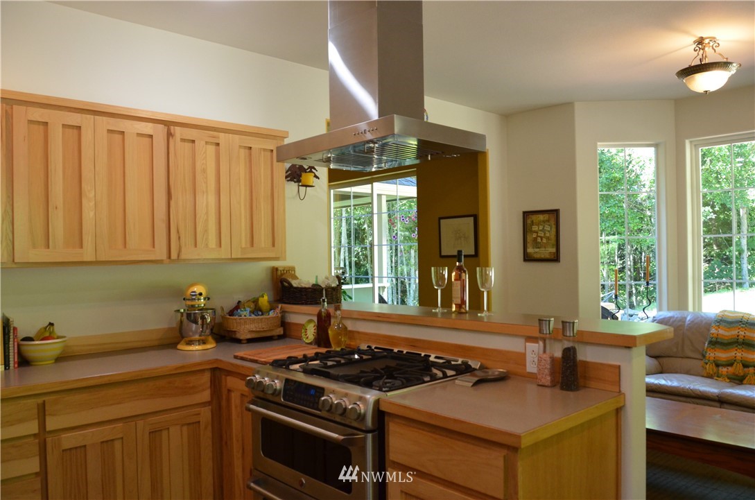 314 Walker Valley Road Port Angeles, WA 98362 - Photo 21 of 25 a kitchen that has a sink and a stove