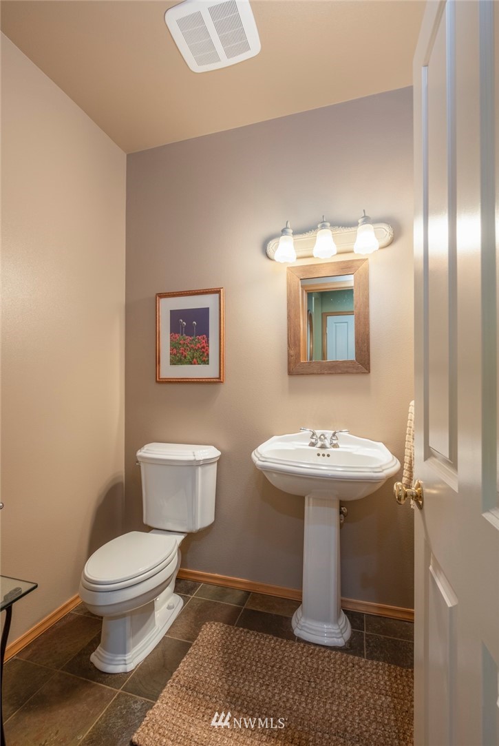 314 Walker Valley Road Port Angeles, WA 98362 - Photo 8 of 25 a bathroom with a toilet sink and mirror