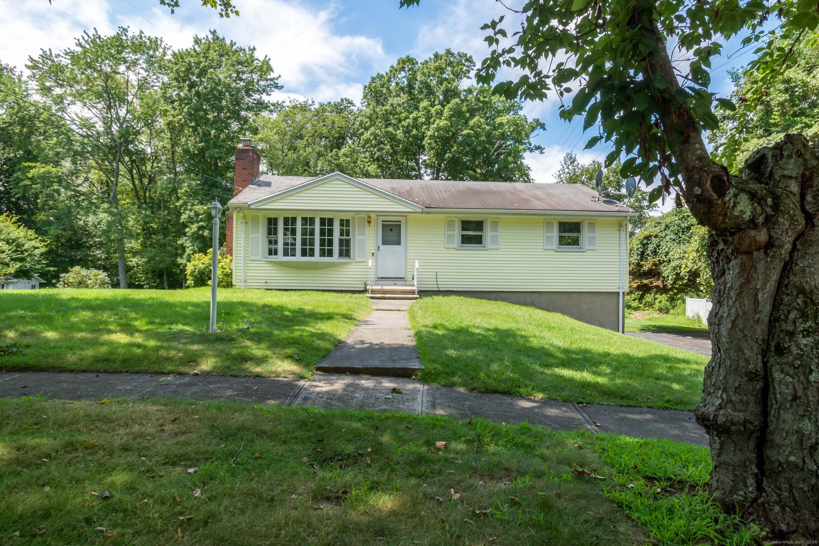 155 Plane Tree Road Stratford, CT 06614 - Photo 1 of 1 a front view of a house with a yard