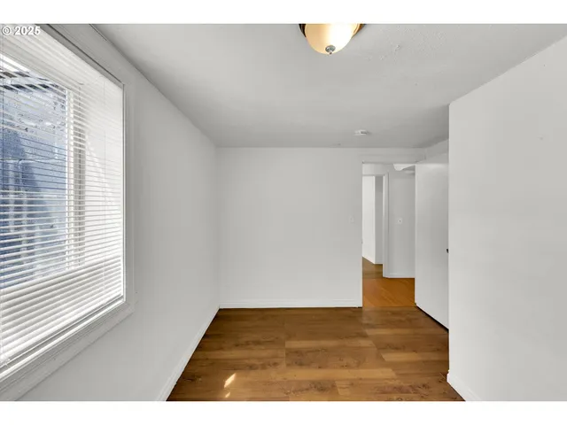 a view of an empty room and window