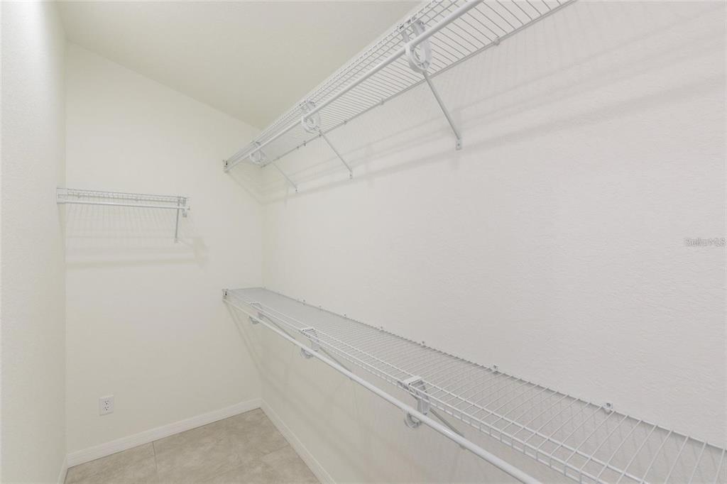 5002 Southeast 7th Place Ocala, FL 34471 - Photo 14 of 30 a view of a room with racks on the wall