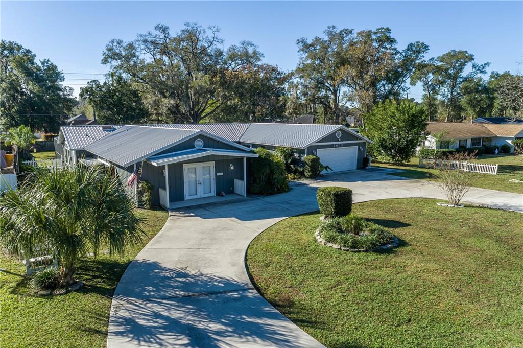 5002 Southeast 7th Place Ocala, FL 34471 - Photo 2 of 30 a front view of a house with a yard