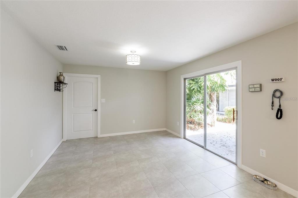 5002 Southeast 7th Place Ocala, FL 34471 - Photo 27 of 30 wooden floor in an empty room with a window