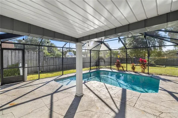 a view of swimming pool with a patio
