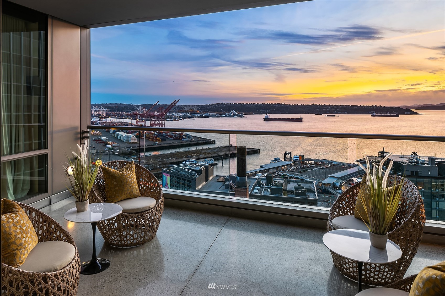 715 2nd Avenue, Unit 1702 Seattle, WA 98104 - Photo 13 of 26 a roof deck with couches and potted plants