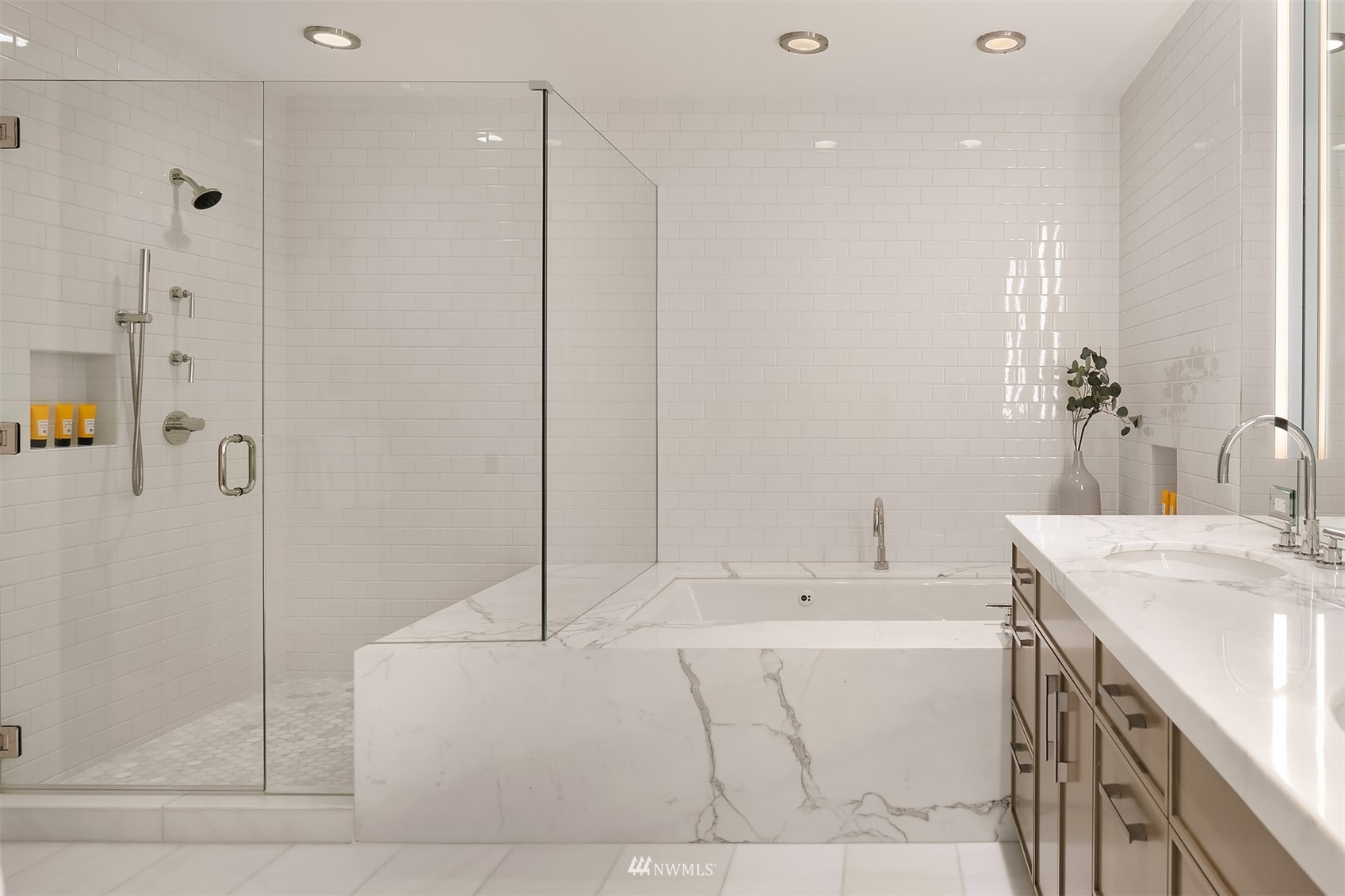 715 2nd Avenue, Unit 1702 Seattle, WA 98104 - Photo 16 of 26 a bathroom with a tub sink and mirror