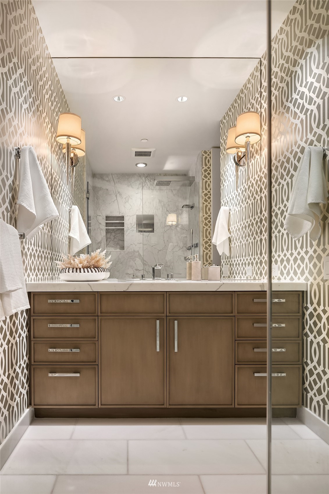 715 2nd Avenue, Unit 1702 Seattle, WA 98104 - Photo 20 of 26 a bathroom with a mirror and a sink