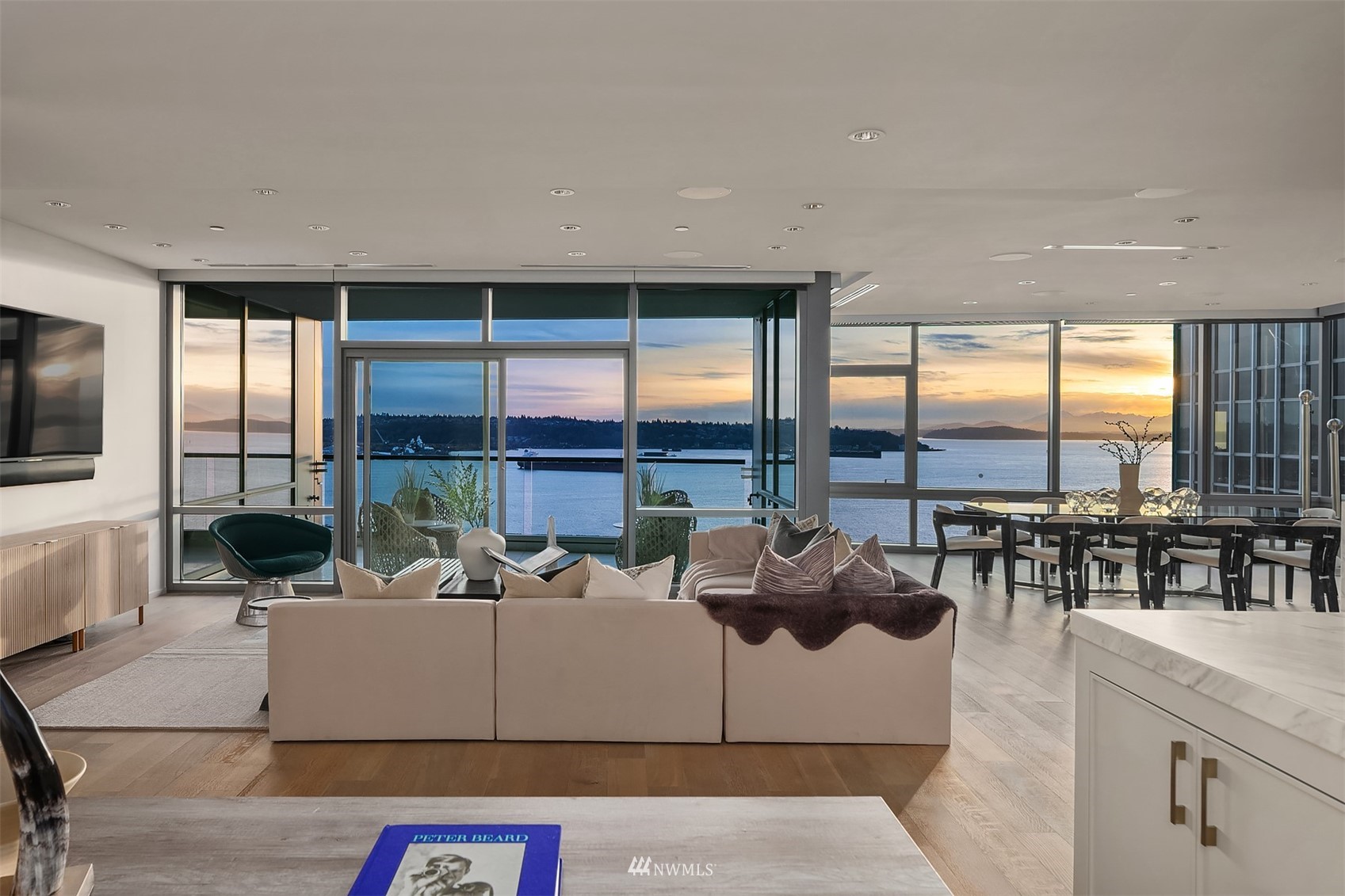 715 2nd Avenue, Unit 1702 Seattle, WA 98104 - Photo 2 of 26 a living room with furniture and a floor to ceiling window