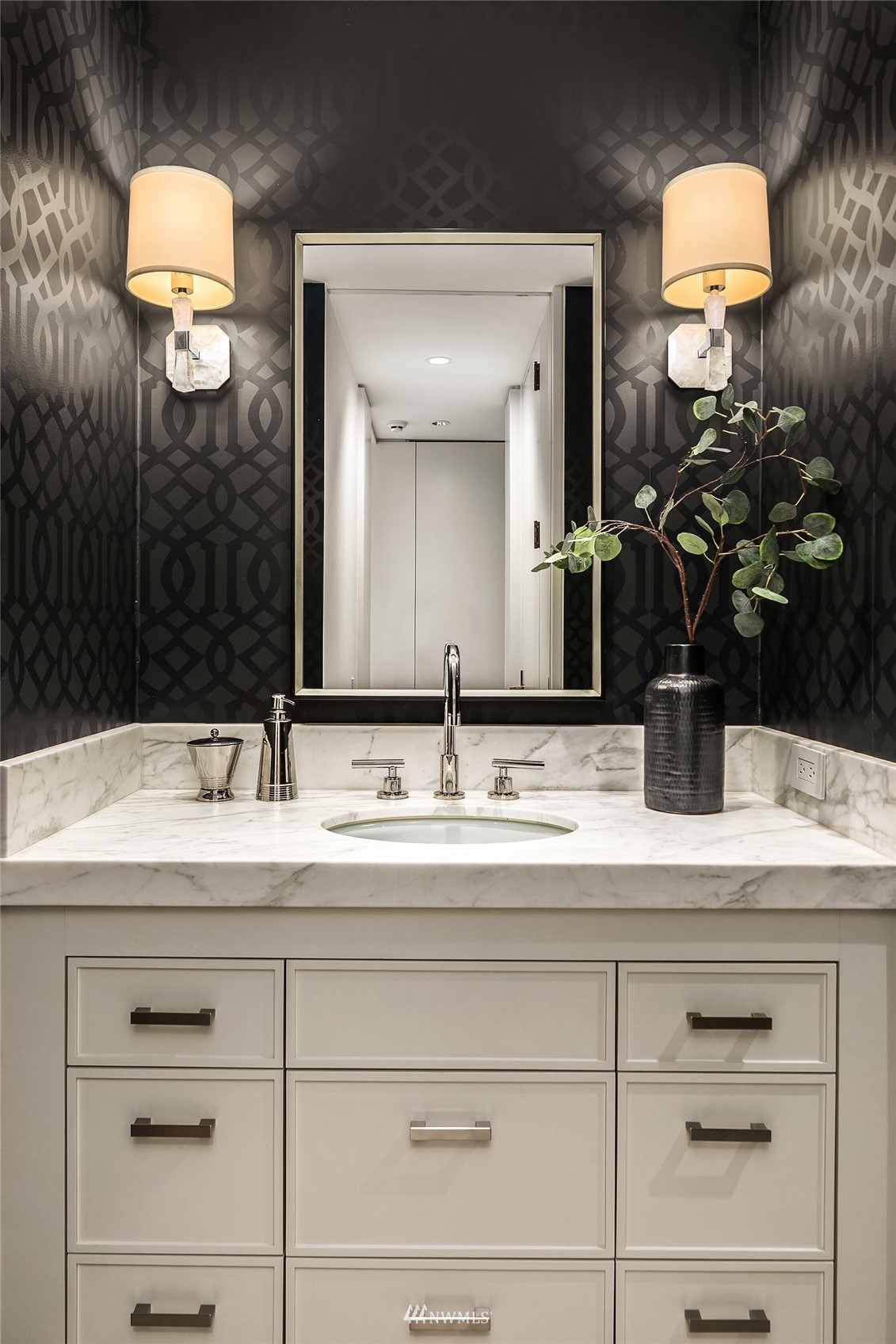 715 2nd Avenue, Unit 1702 Seattle, WA 98104 - Photo 22 of 26 a bathroom with a sink and a mirror