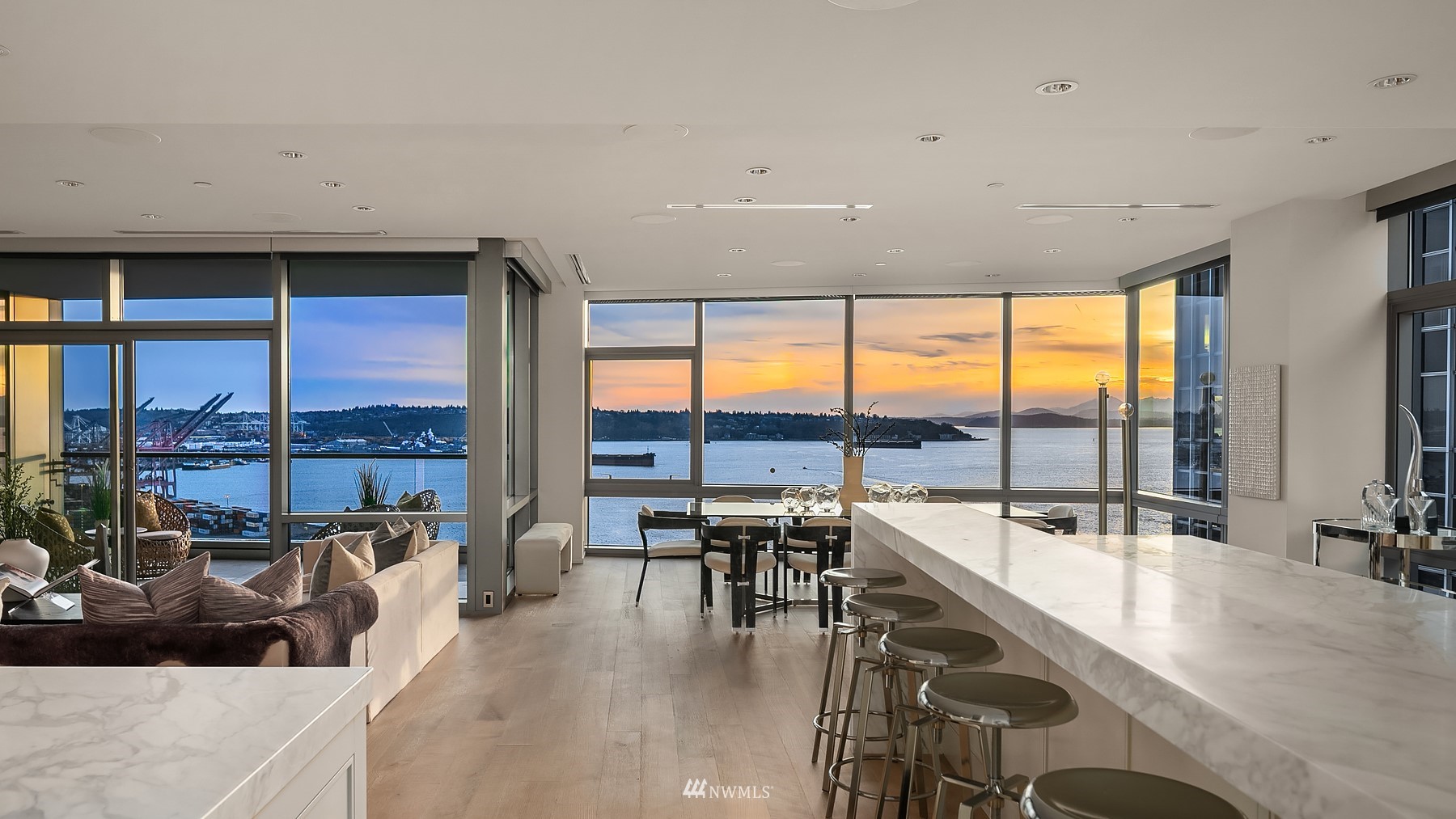 715 2nd Avenue, Unit 1702 Seattle, WA 98104 - Photo 3 of 26 a room with lots of furniture and a large window