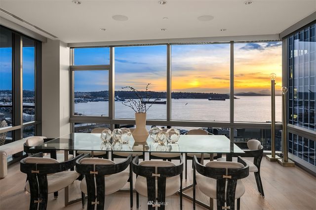 a view of a dining room with furniture and window