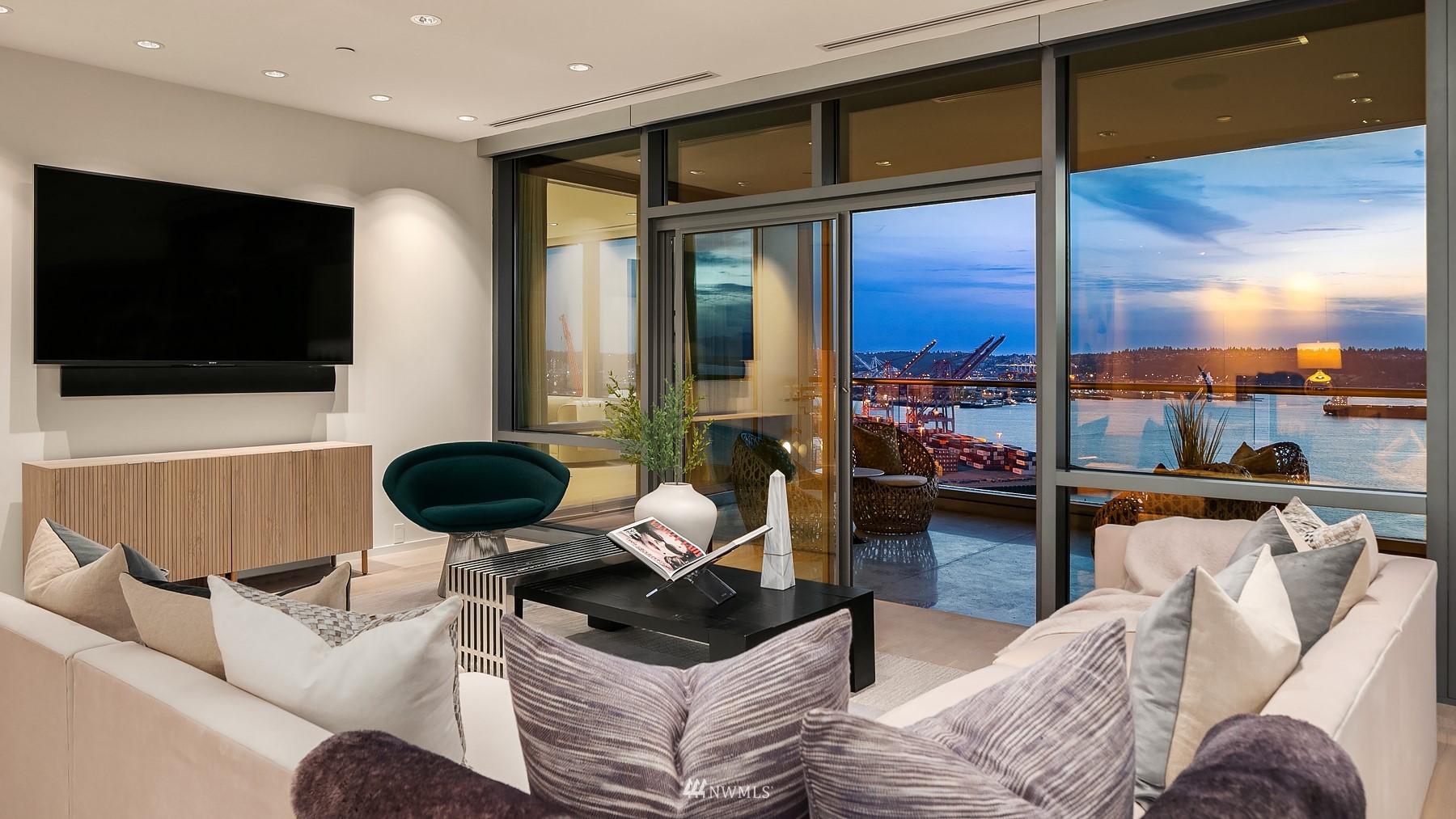 715 2nd Avenue, Unit 1702 Seattle, WA 98104 - Photo 7 of 26 a living room with furniture and a flat screen tv