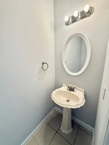 a bathroom with a sink a mirror and a toilet