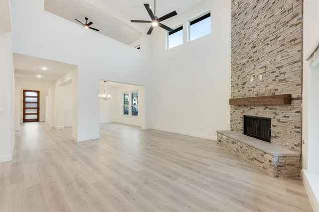 wooden floor in an empty room with a fireplace