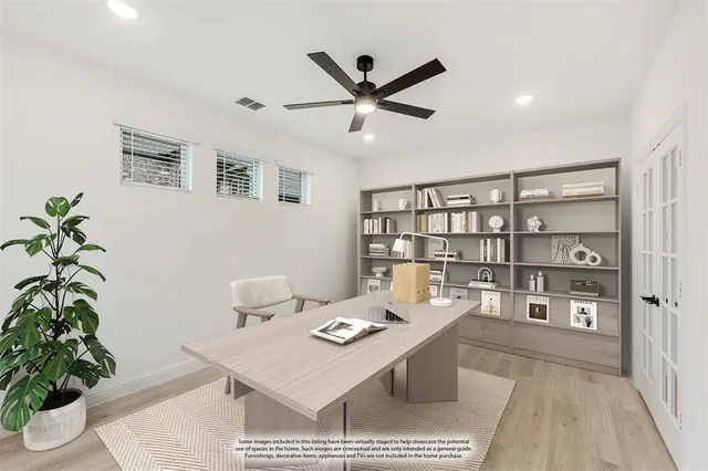 a workspace with furniture and a potted plant