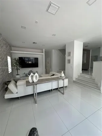 a living room with furniture and a couch