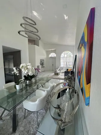 a view of a livingroom with furniture and a chandelier