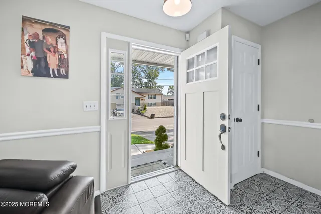 a living room with furniture and a gate