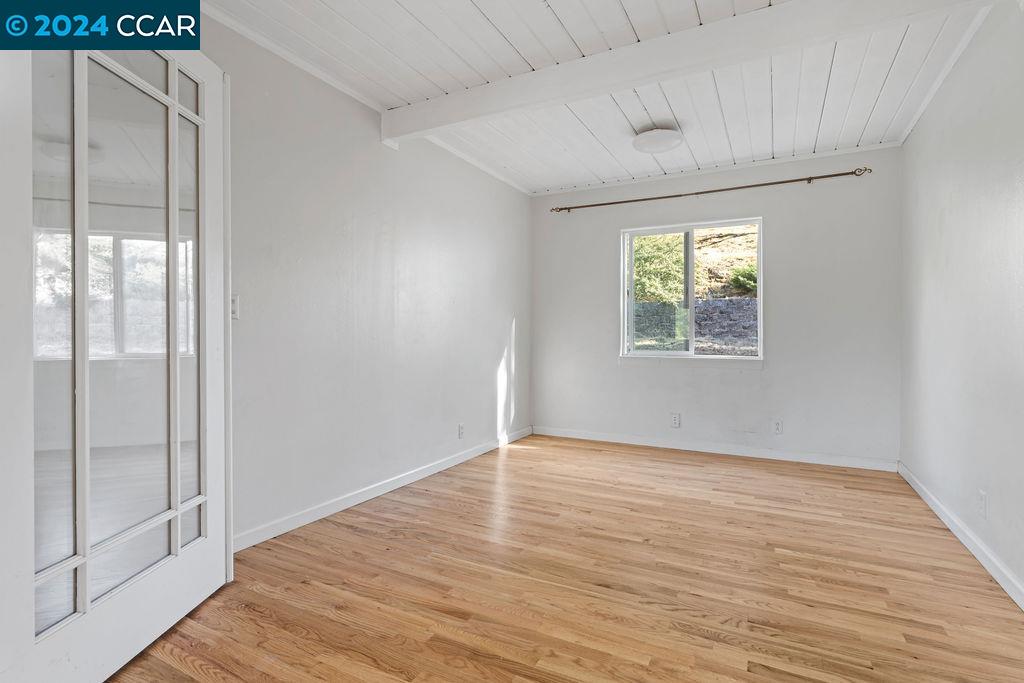 1352 Sunset Loop Lafayette, CA 94549 - Photo 15 of 29 a view of an empty room with wooden floor and a window