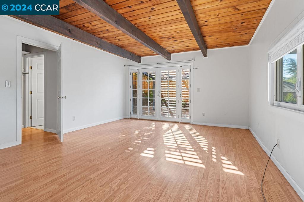 1352 Sunset Loop Lafayette, CA 94549 - Photo 10 of 29 a view of an empty room with wooden floor and a window