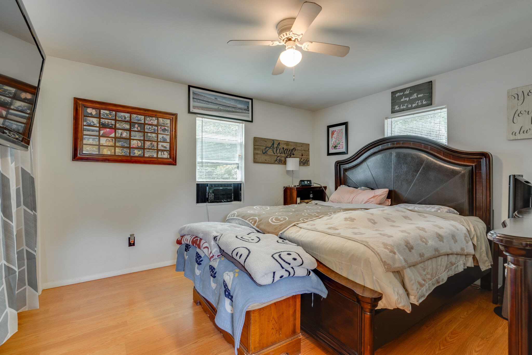 537 Chapmansboro Road Ashland City, TN 37015 - Photo 13 of 28 a bedroom with a bed a window and a chandelier