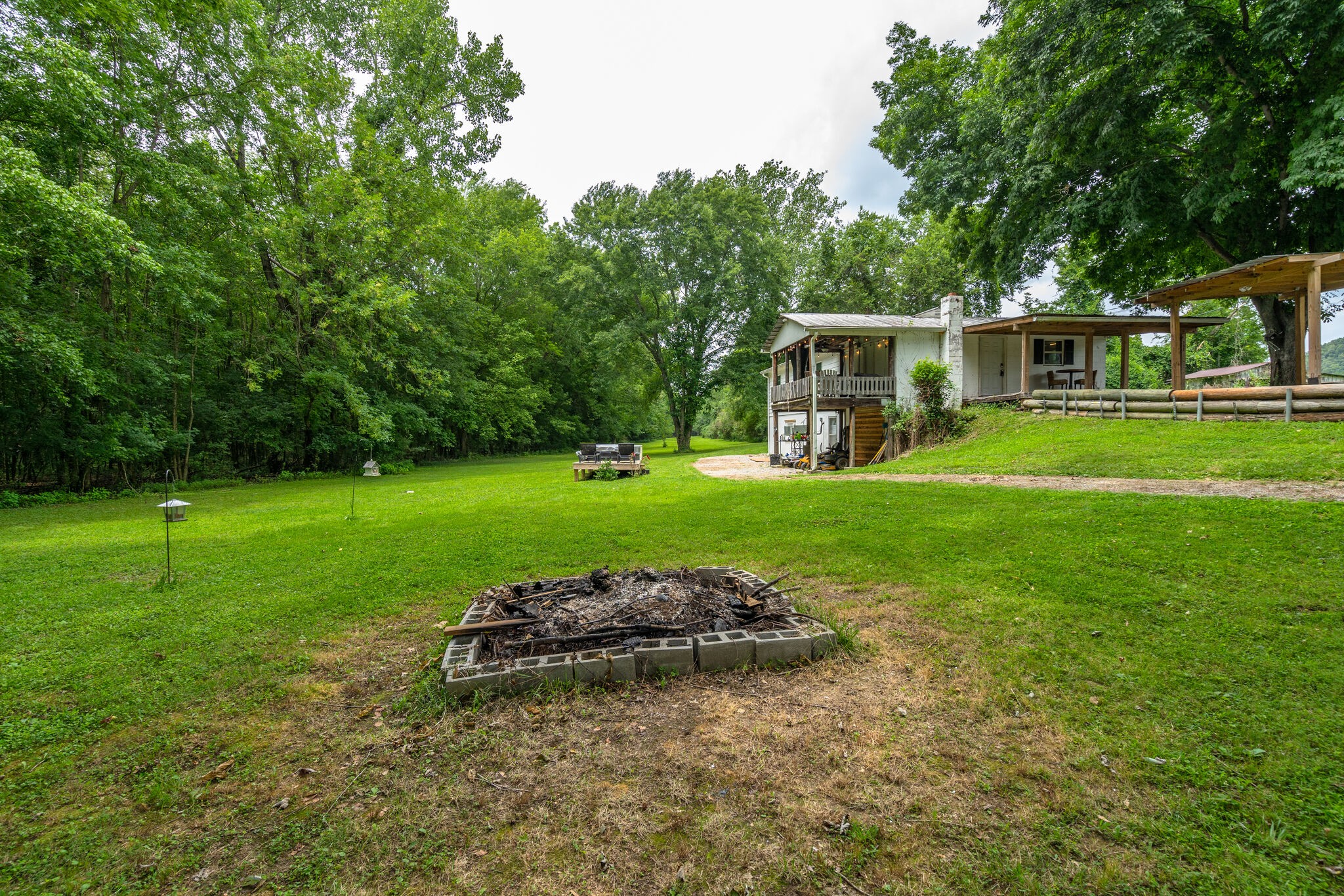 537 Chapmansboro Road Ashland City, TN 37015 - Photo 23 of 28 a view of a backyard with a garden and entertaining space
