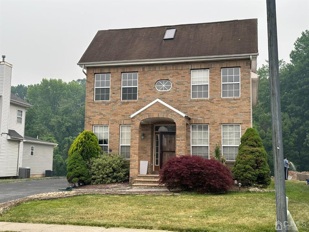 a front view of a house with a yard
