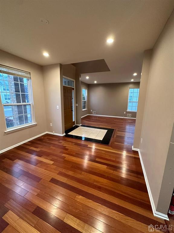 58 Timber Ridge Road North Brunswick, NJ 08902 - Photo 3 of 8 a view of an empty room with wooden floor and windows