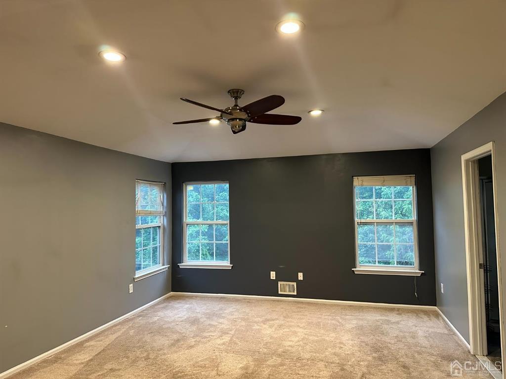 58 Timber Ridge Road North Brunswick, NJ 08902 - Photo 4 of 8 a view of an empty room with a window