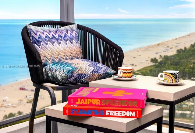 a balcony with table and chairs