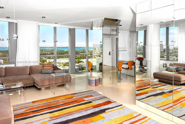 a living room with furniture and a rug