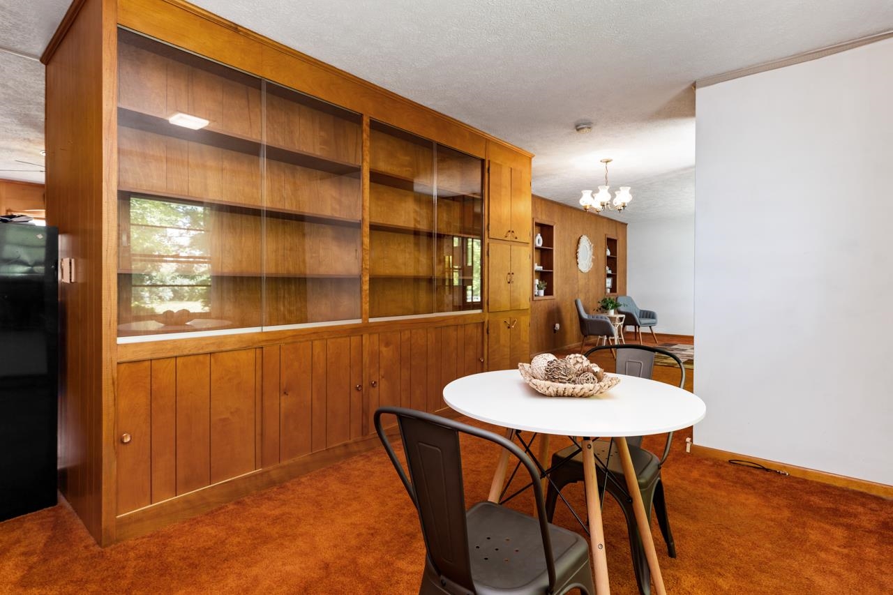 3252 Lyndhurst Road Stuarts Draft, VA 24477 - Photo 13 of 75 a view of a dining room with furniture and wooden floor