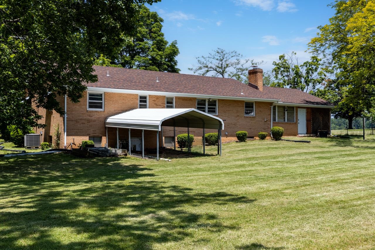 3252 Lyndhurst Road Stuarts Draft, VA 24477 - Photo 42 of 75 a front view of a house with a garden