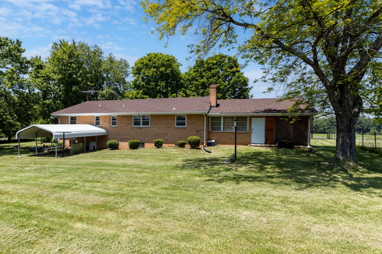 3252 Lyndhurst Road Stuarts Draft, VA 24477 - Photo 44 of 75 a front view of a house with a yard and trees