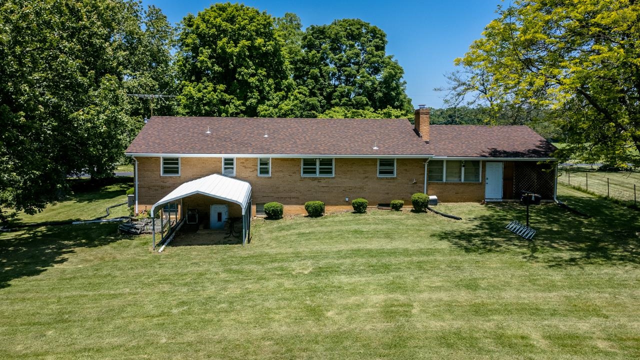 3252 Lyndhurst Road Stuarts Draft, VA 24477 - Photo 66 of 75 a front view of a house with garden