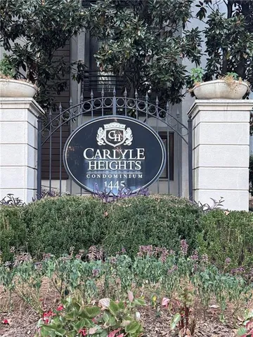 a wooden bench sitting in front of a building
