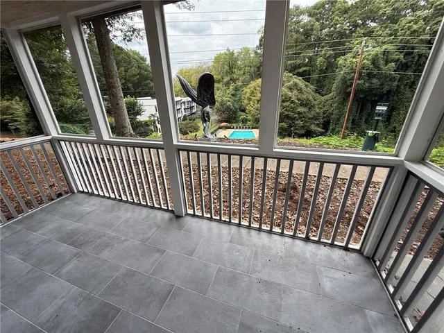 a view of a balcony with wooden floor